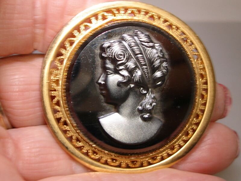 Vintage gold tone filigree cameo brooch pin with a black glass woman portrait