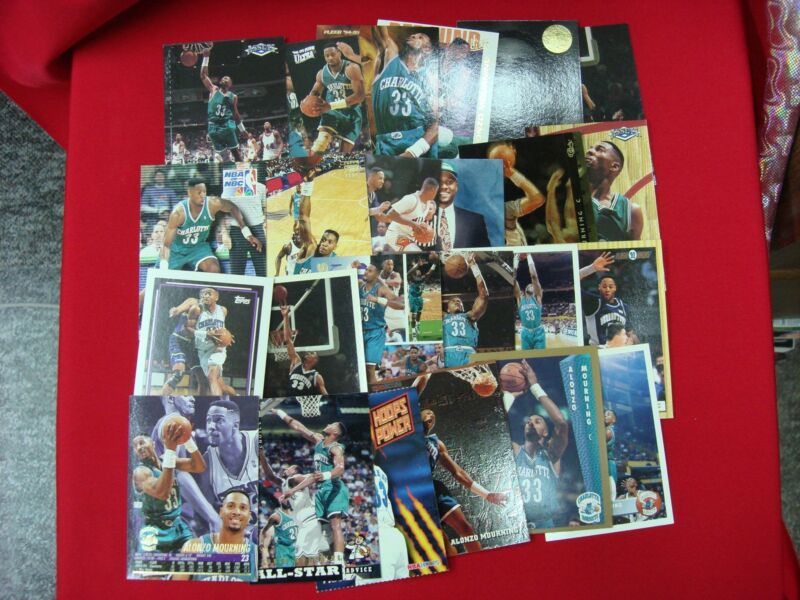 Collection of 24 different Alonzo Mourning basketball cards, including rookie and insert variations.