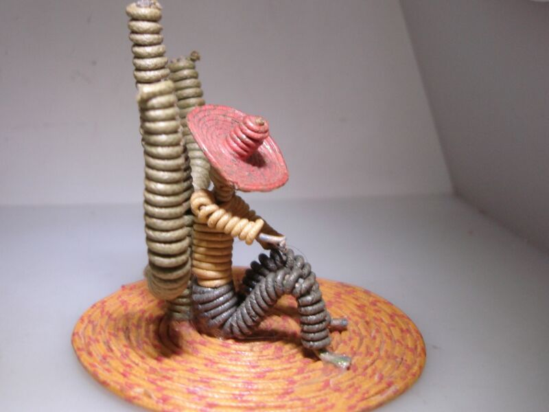 Vintage 1940s Mexican wire wrapped souvenir featuring a figure and cactus design