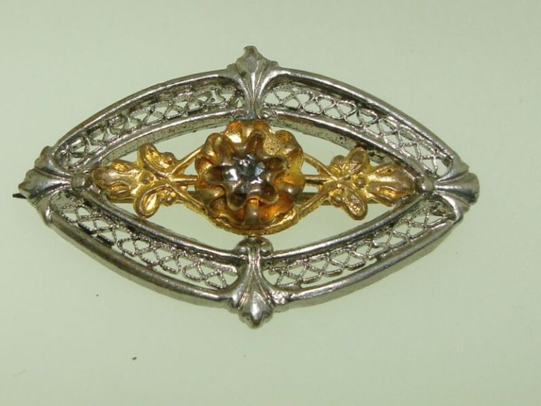 Antique Victorian filigree pin brooch with silver and gold-washed rhinestones.