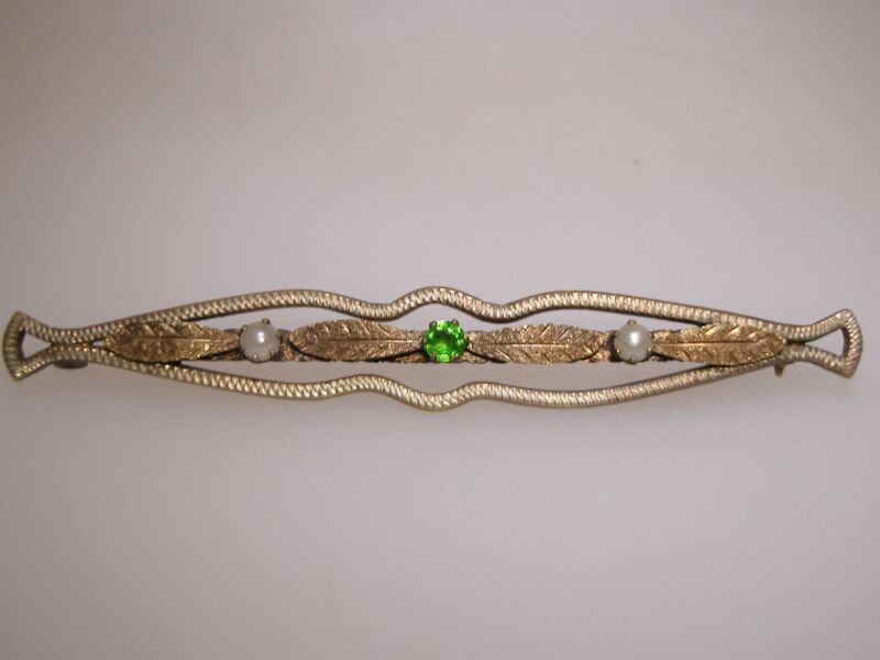Antique Art Nouveau gold-washed bar pin with seed pearls and peridot