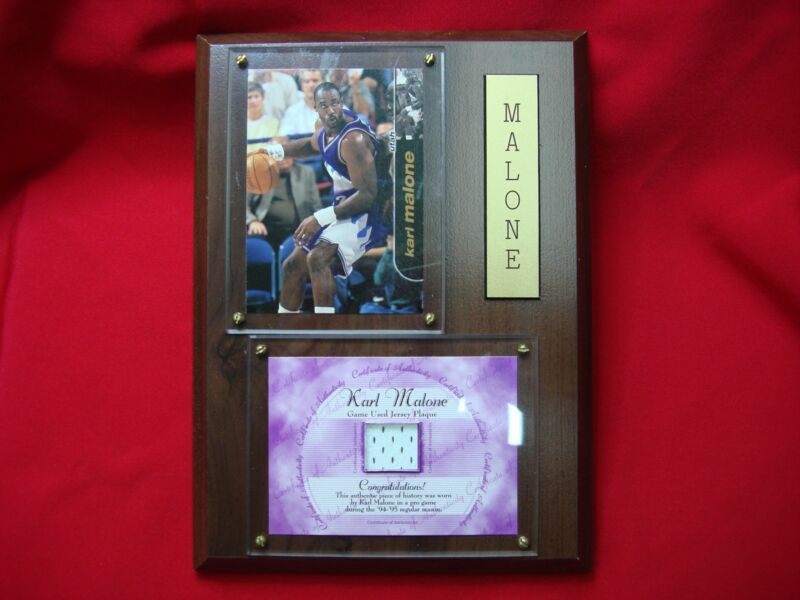 Karl Malone game-used jersey plaque featuring a piece of authentic jersey from the 1994-95 season