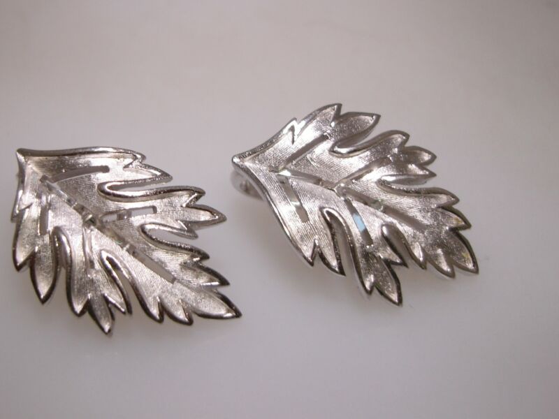 Vintage Crown Trifari clip-on earrings with a delicate filigree leaf design