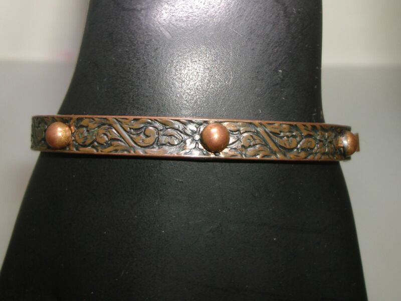 Handmade copper bangle bracelet with floral and swirl design, hinged and beaded