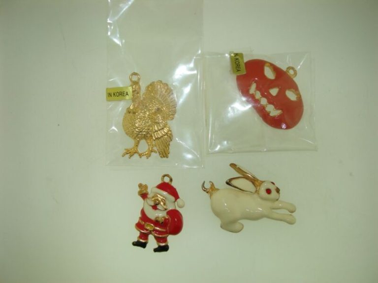 Vintage Phister Ent. enamel charms from 1996, featuring a turkey, pumpkin, Santa Claus, and bunny.