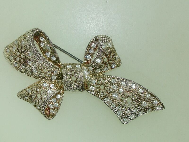 Vintage filigree bow pin with rhinestones, signed P.D. Premier Designs