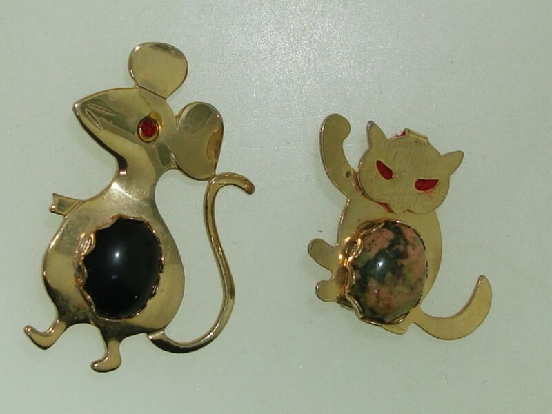 Vintage 1960s cat and mouse pins with red rhinestone and gemstone accents.