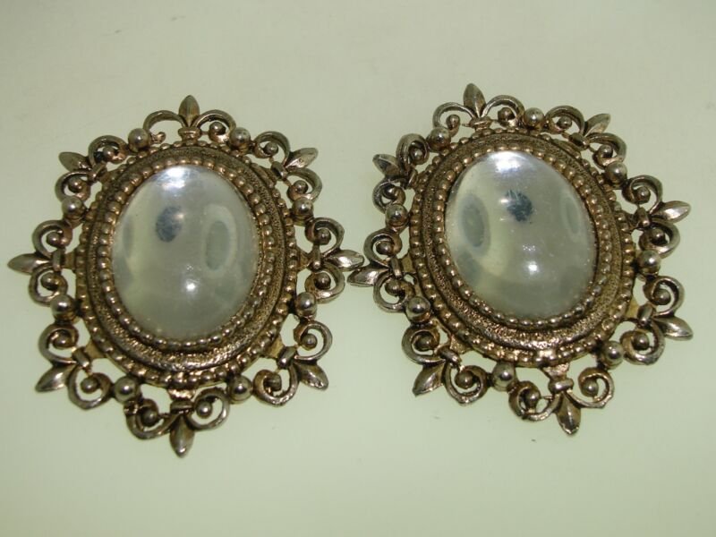 Vintage 1960s fleur-de-lis earrings with sparkling clear glass cabochons
