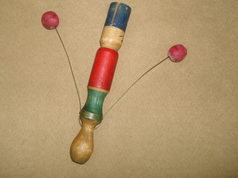 Vintage wooden soldier noisemaker from the 1930s