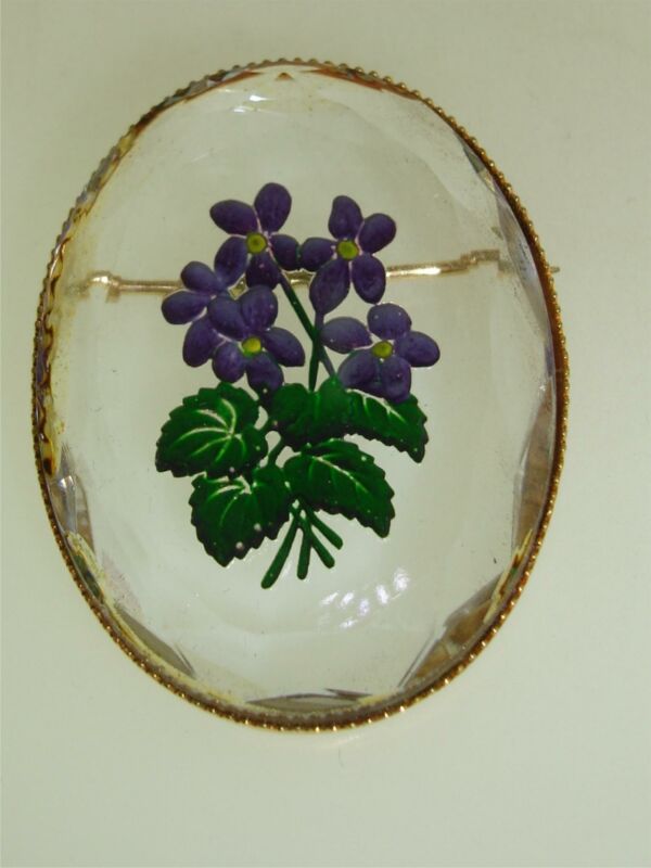 Vintage reverse carved glass violet pin with gold tone metal setting