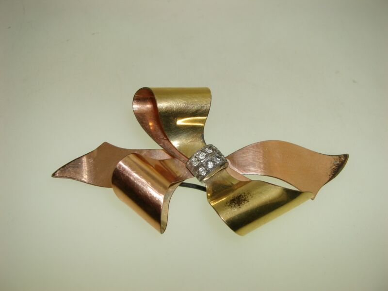 Vintage Taylord rose gold and yellow gold filled bow pin with rhinestones