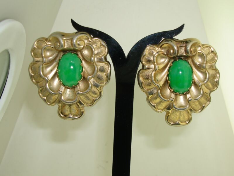 Vintage 1940s Marino clip-on earrings with a ruffled green glass design