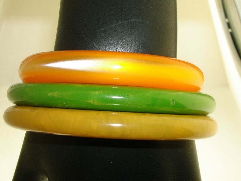 Set of three vintage 1950s Lucite bangle bracelets in unique designs and excellent condition.