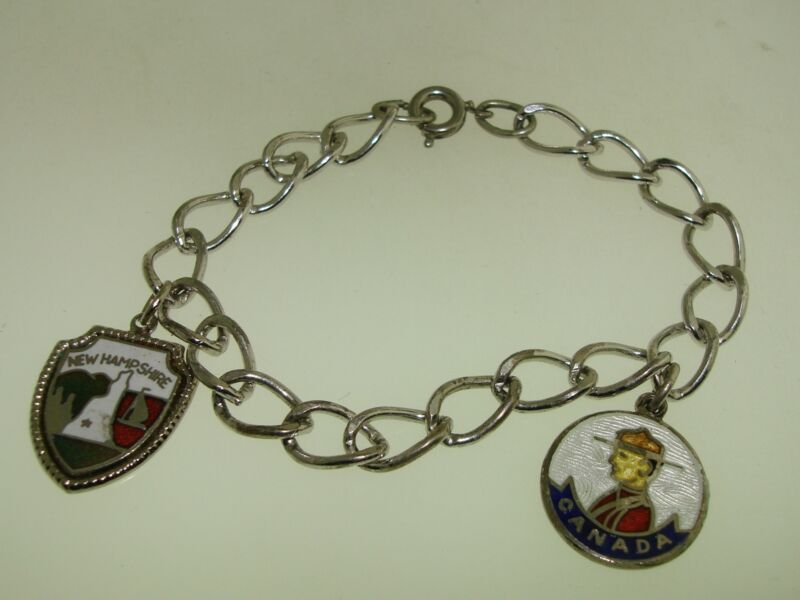 Vintage sterling silver enamel Canada Mountie and New Hampshire charm bracelet