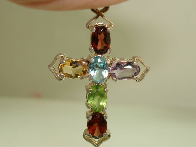 Vintage sterling silver cross pendant with 3 carat assorted gemstones.