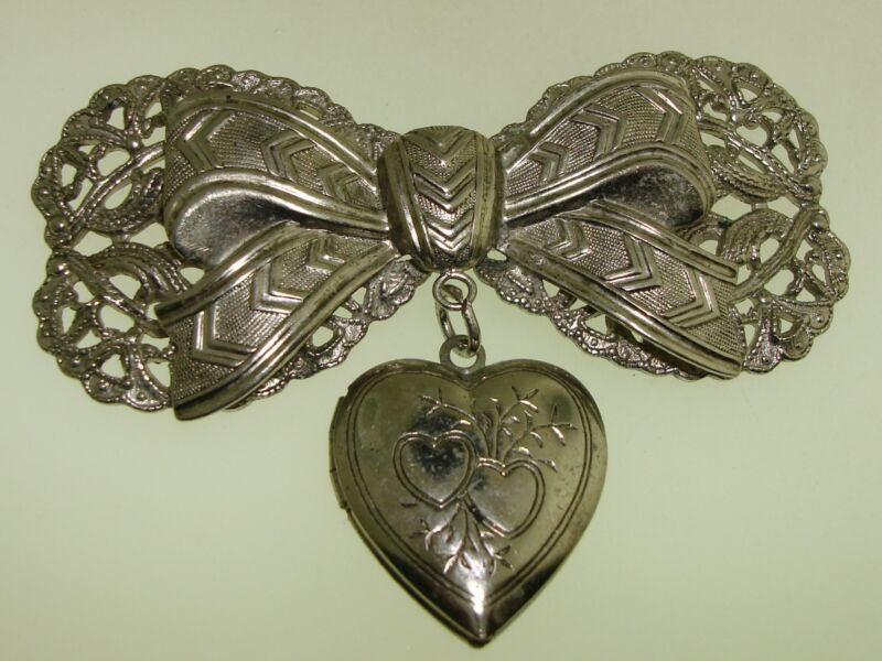 Vintage 1940s faux silver filigree bow pin with heart locket