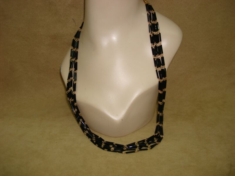 Vintage 1970s black glass and gold necklace, eight strands, statement piece