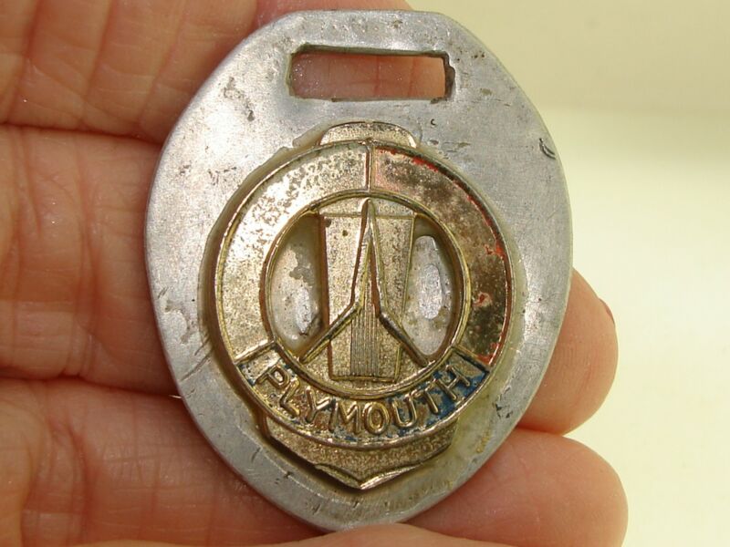 Vintage 1970s Plymouth car key chain made of silver metal