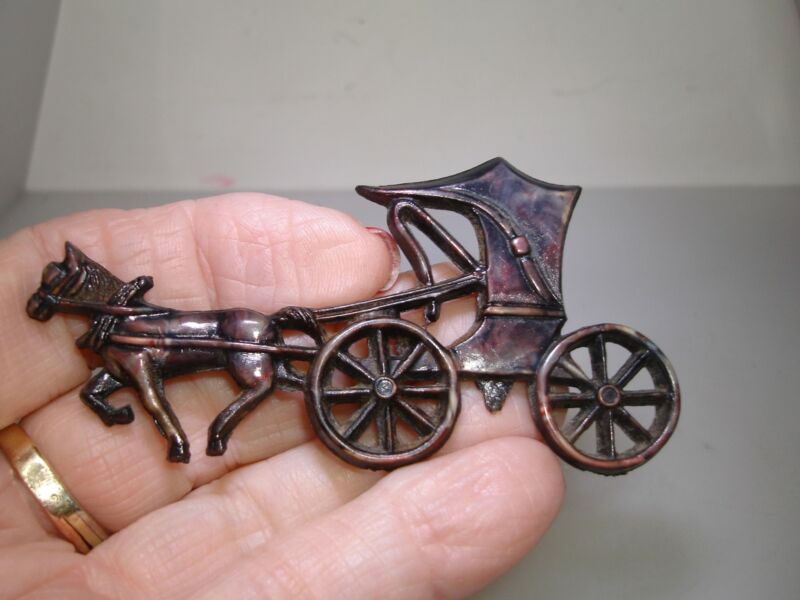 Vintage molded celluloid horse and carriage brooch pin