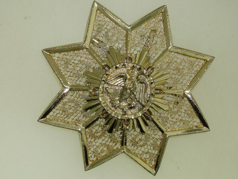 Vintage 1960s gold-tone filigree star brooch with winged eagle
