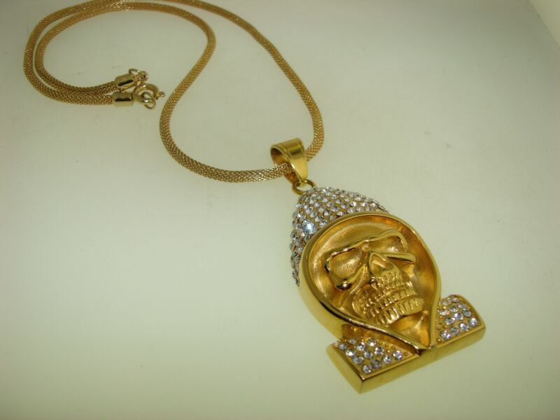 Gold-tone skull pendant necklace with cubic zirconia accents