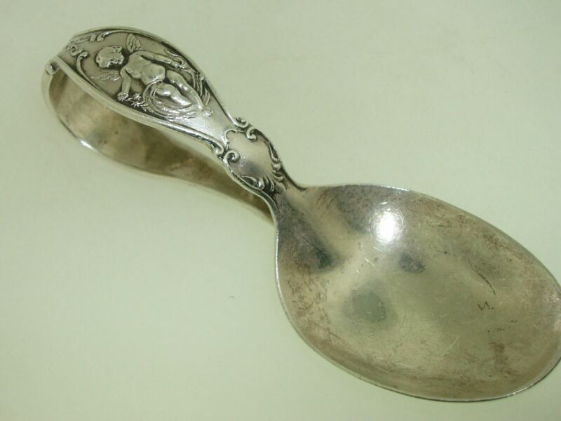 Antique 1894 Reed & Barton sterling silver baby spoon with a cherub design and the initial FGG