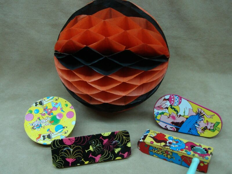 Vintage metal noisemakers and a giant orange and black honeycomb ball, circa 1940s-1950s
