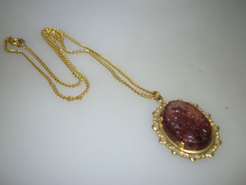 Vintage carved amethyst pendant necklace in gold-tone metal