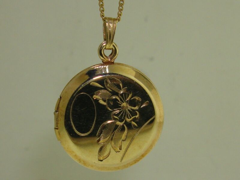 Vintage gold filled floral locket necklace with an engraved oval, 18 inch chain