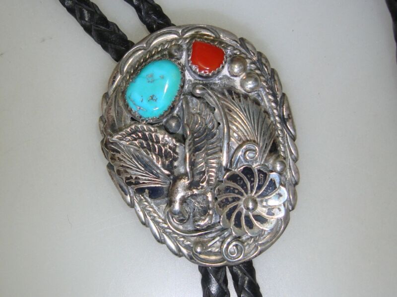 Vintage Navajo sterling silver eagle bolo tie with sleeping beauty turquoise and coral