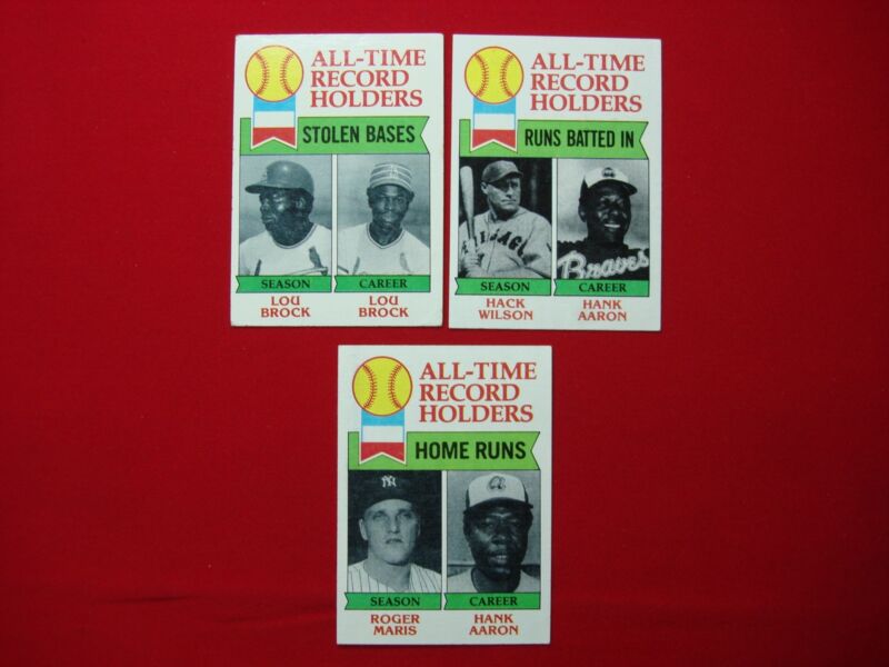 Three vintage 1979 Topps baseball cards featuring Hank Aaron and Roger Maris.