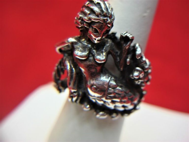 Solid sterling silver mermaid ring with intricate detailing in a biker style