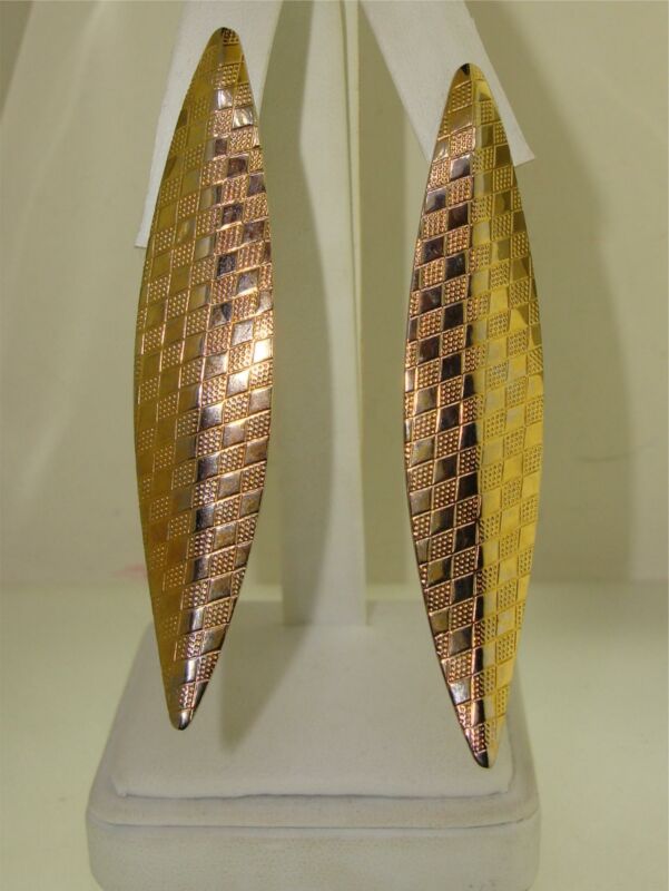 Vintage 1970s gold tone clip-on earrings, mod style, long and textured