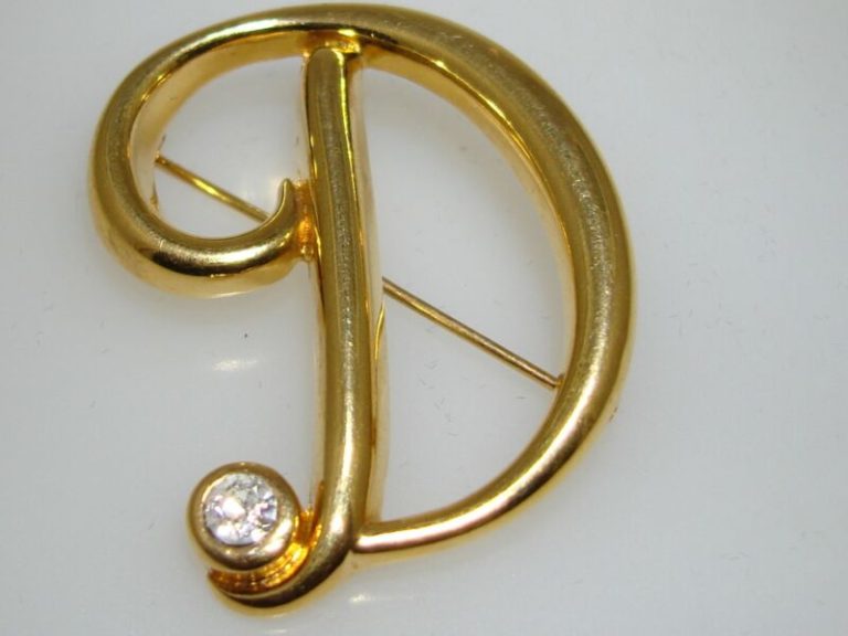 Vintage Monet gold-tone initial 'D' pin with CZ accents