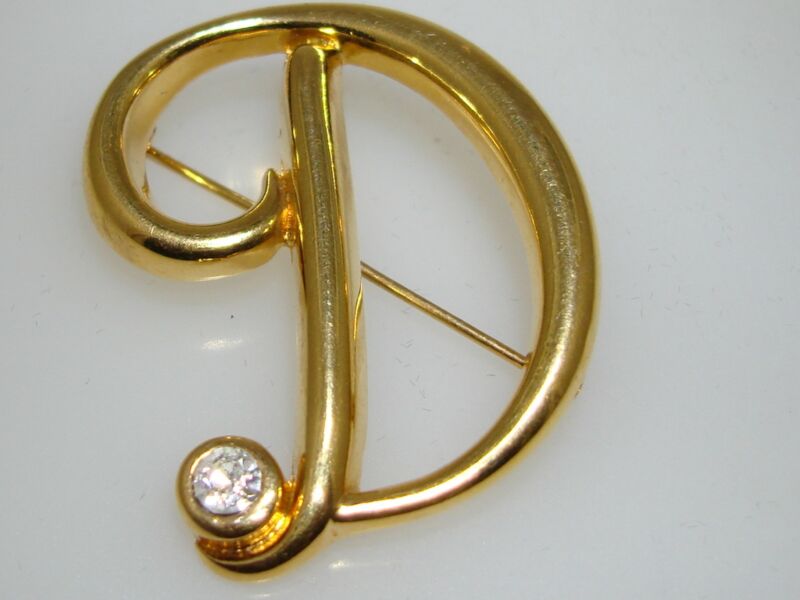 Vintage Monet gold-tone initial 'D' pin with CZ accents