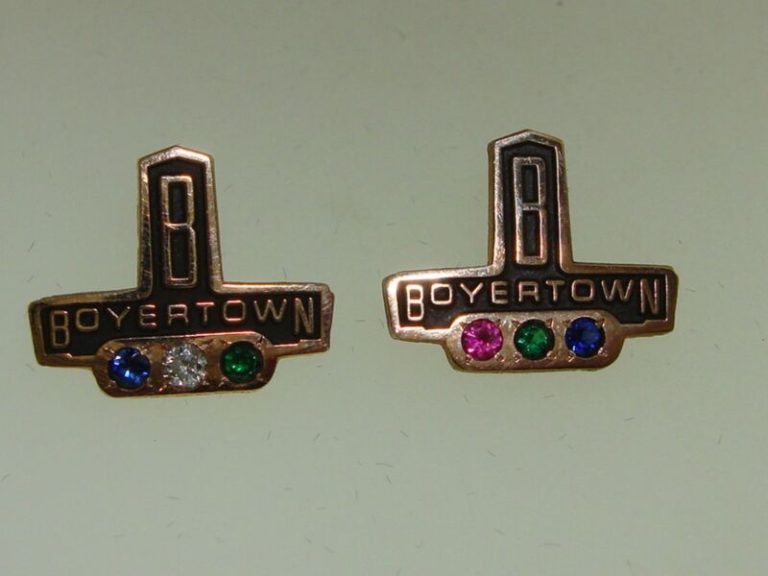 Vintage Boyertown Body Works gold-filled gemstone award pins for Terry Berry featuring topaz and diamond.
