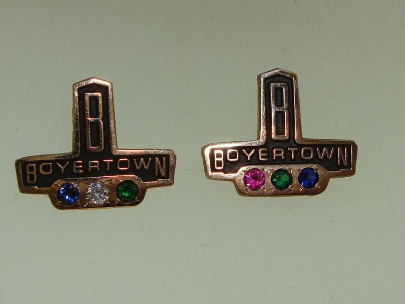 Vintage Boyertown Body Works gold-filled gemstone award pins for Terry Berry featuring topaz and diamond.