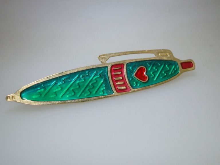 Vintage gold-tone enamel ballpoint pen pin with red and green enamel work.