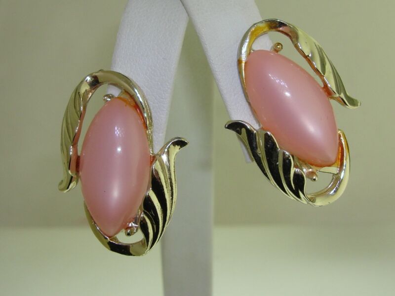 Vintage 1950s pink lucite clip-on earrings with elegant oval cabochons