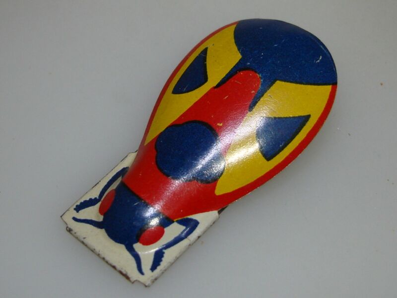 Vintage enamel tin bug clicker