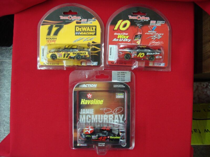 Collectible NASCAR die-cast cars featuring Matt Kenseth #17, Johnny Benson #10, and Jamie McMurray #42.