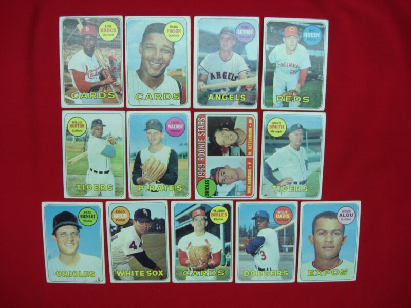 Collection of 1969 Topps baseball cards featuring Lou Brock, Vada Pinson, and Jesus Alou