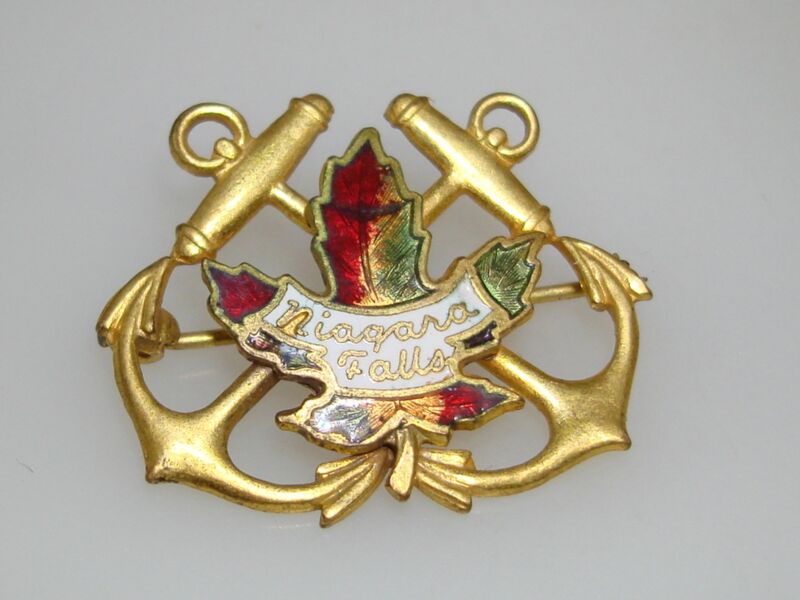 Vintage Niagara Falls enamel pin with gold-tone anchors and maple leaf souvenir