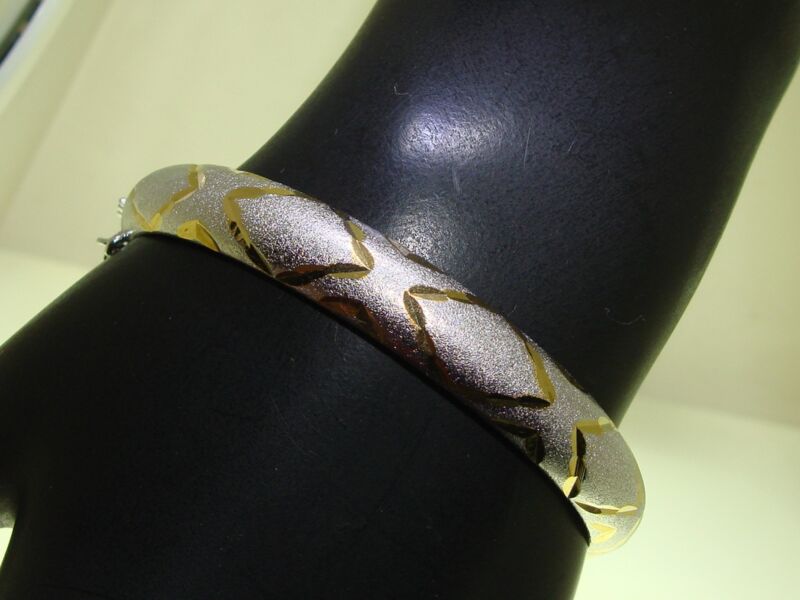 Sterling silver bangle bracelet with gold accents