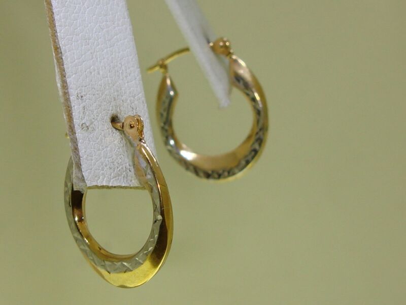 14K gold hoop earrings with a yellow and white gold star design