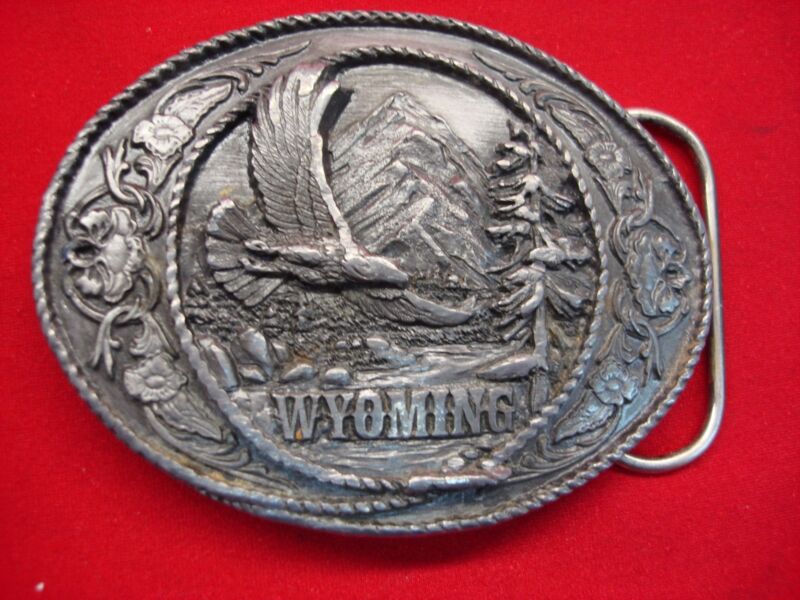 Vintage 3D belt buckle featuring a soaring eagle, circa 1991. Brass construction with minor wear.