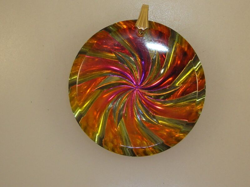 Vintage 1960s psychedelic glass pendant with a spinning wheel design