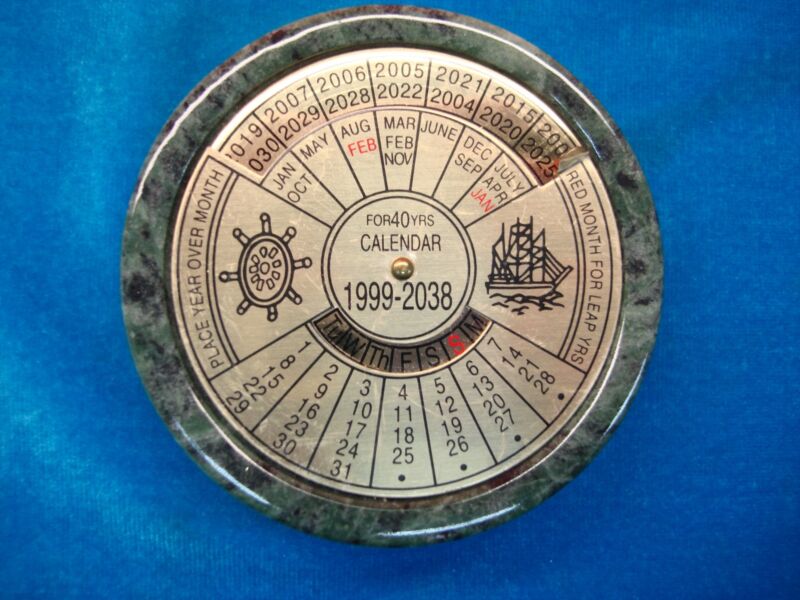 Vintage nautical desk calendar with green marble base and brass inlays, 1997-2038
