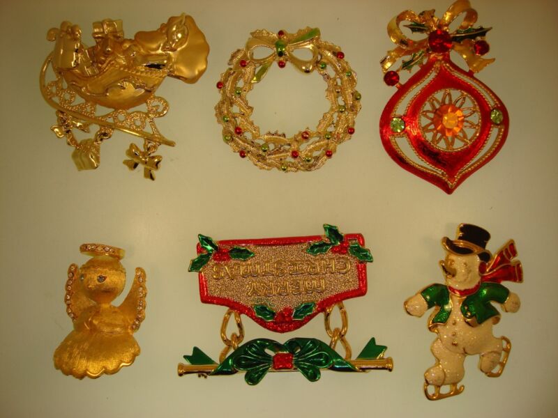 Collection of six vintage Christmas holiday pins including Ultra, SFJ, Gerry's, AJC and Danecraft.