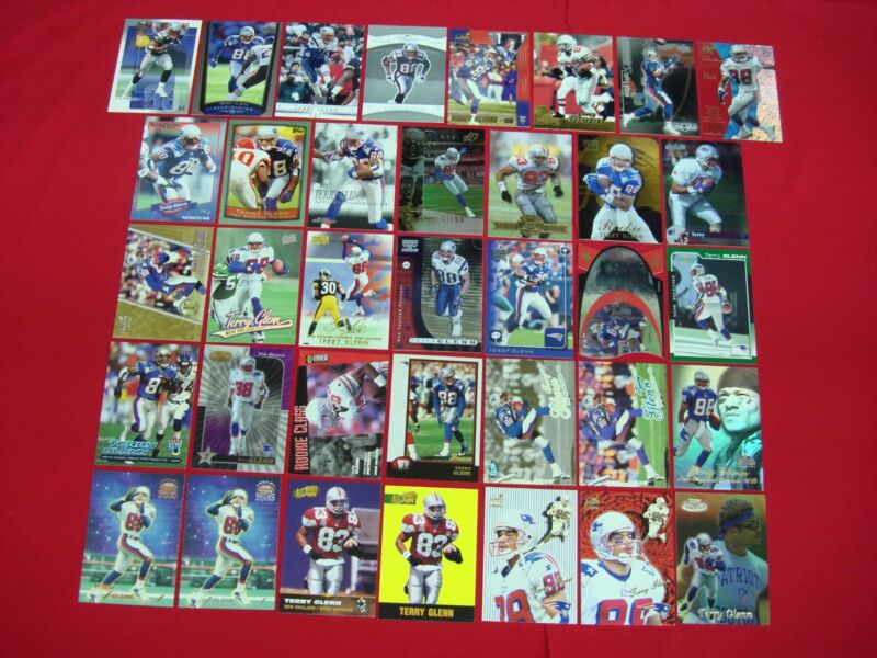 Collection of 36 Terry Glenn football cards, including serial numbered, parallel, die-cut and premium cards.